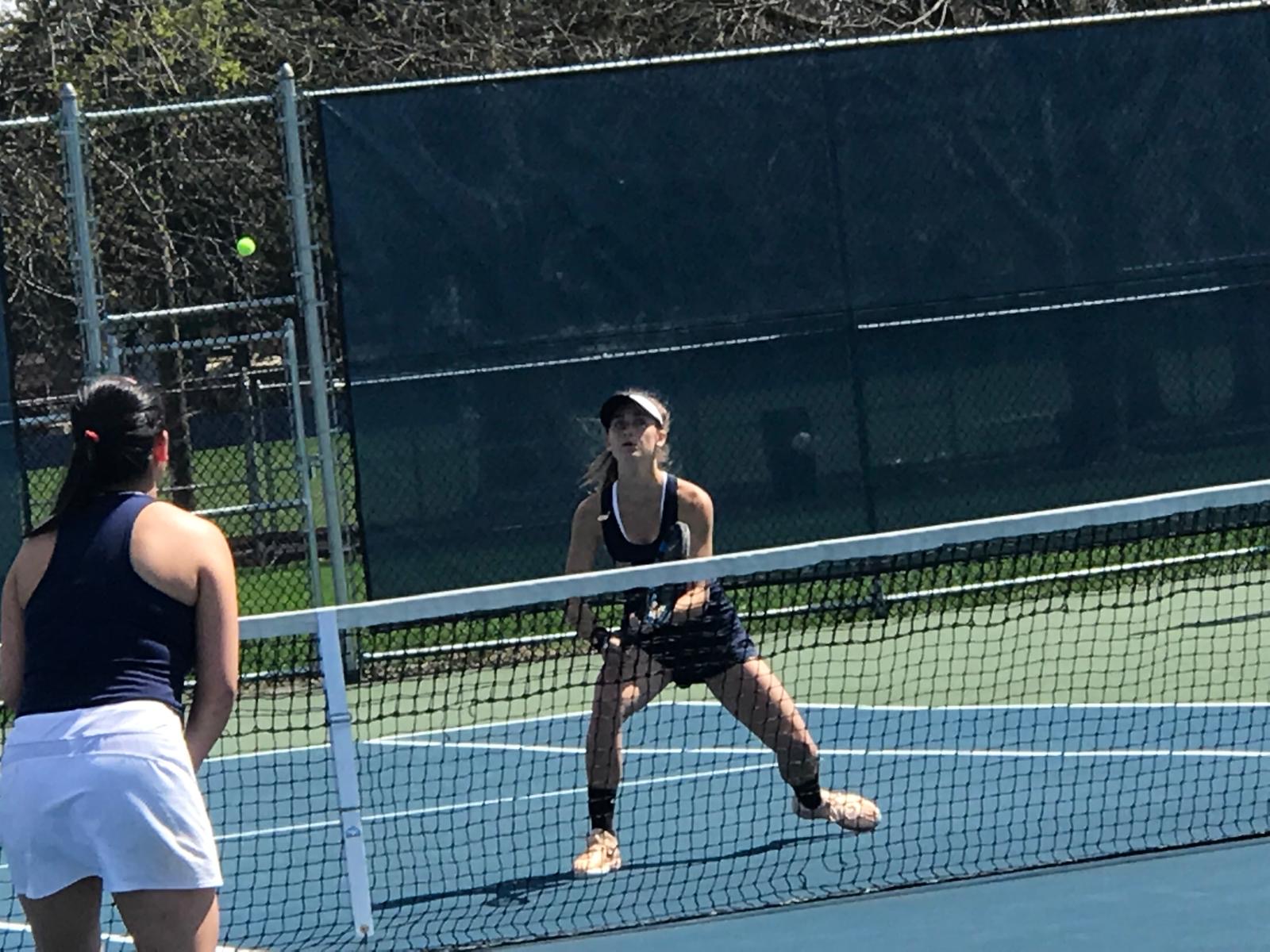 High School students playing tennis